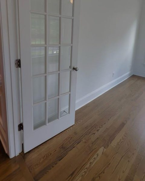 Another view of the finished bedroom conversion, photographed in low light