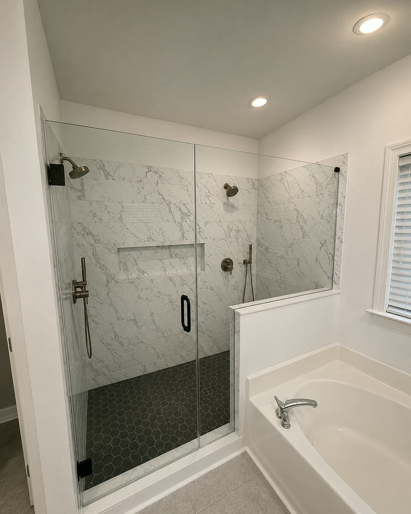 The completed bathroom with frameless glass installed and the room cleaned