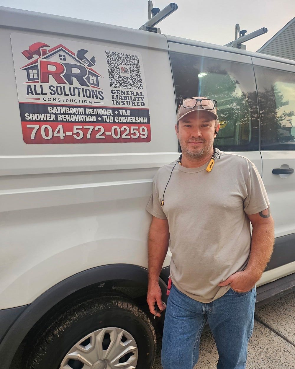Rocco, co-owner and Construction Manager, beside the company van